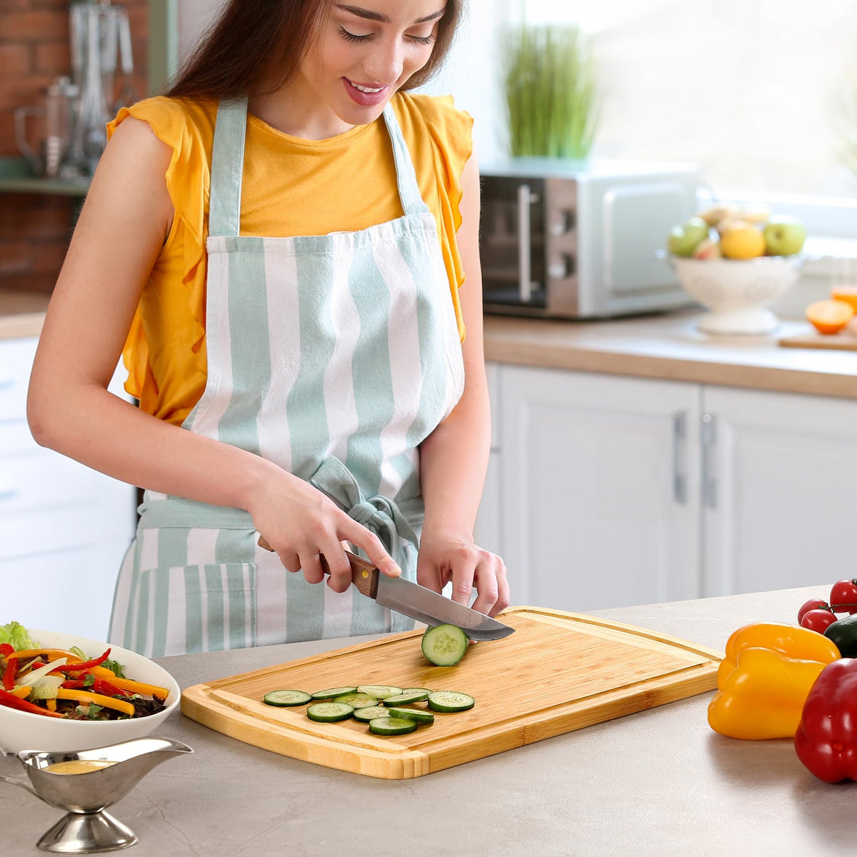HIWARE 16 by 10 inch bamboo board fits compact kitchens.