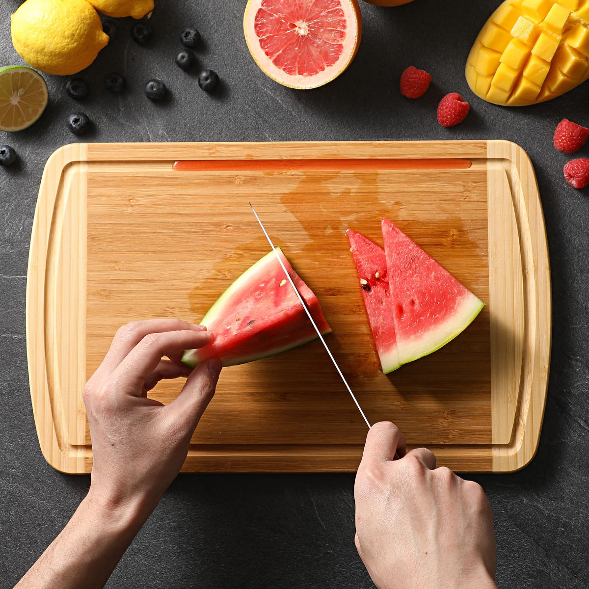 HIWARE cutting board with juice groove catches juices and spills neatly.