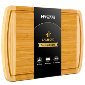 HIWARE large bamboo cutting board with juice groove for mess-free prep.