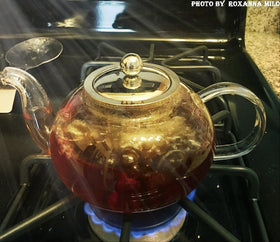 HIWARE teapot designed for blooming teas with visible leaves unfurling