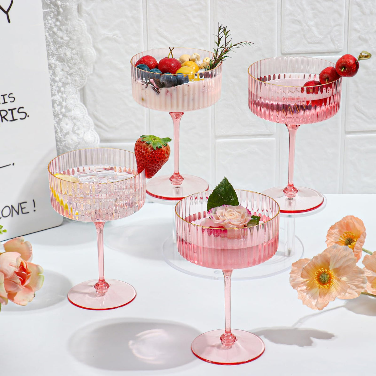 HKSZEH gold rim pink champagne coupe catching light for festive toasts