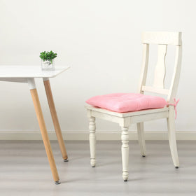 HLOVME pink cushion on the floor creates kid-friendly reading nook.