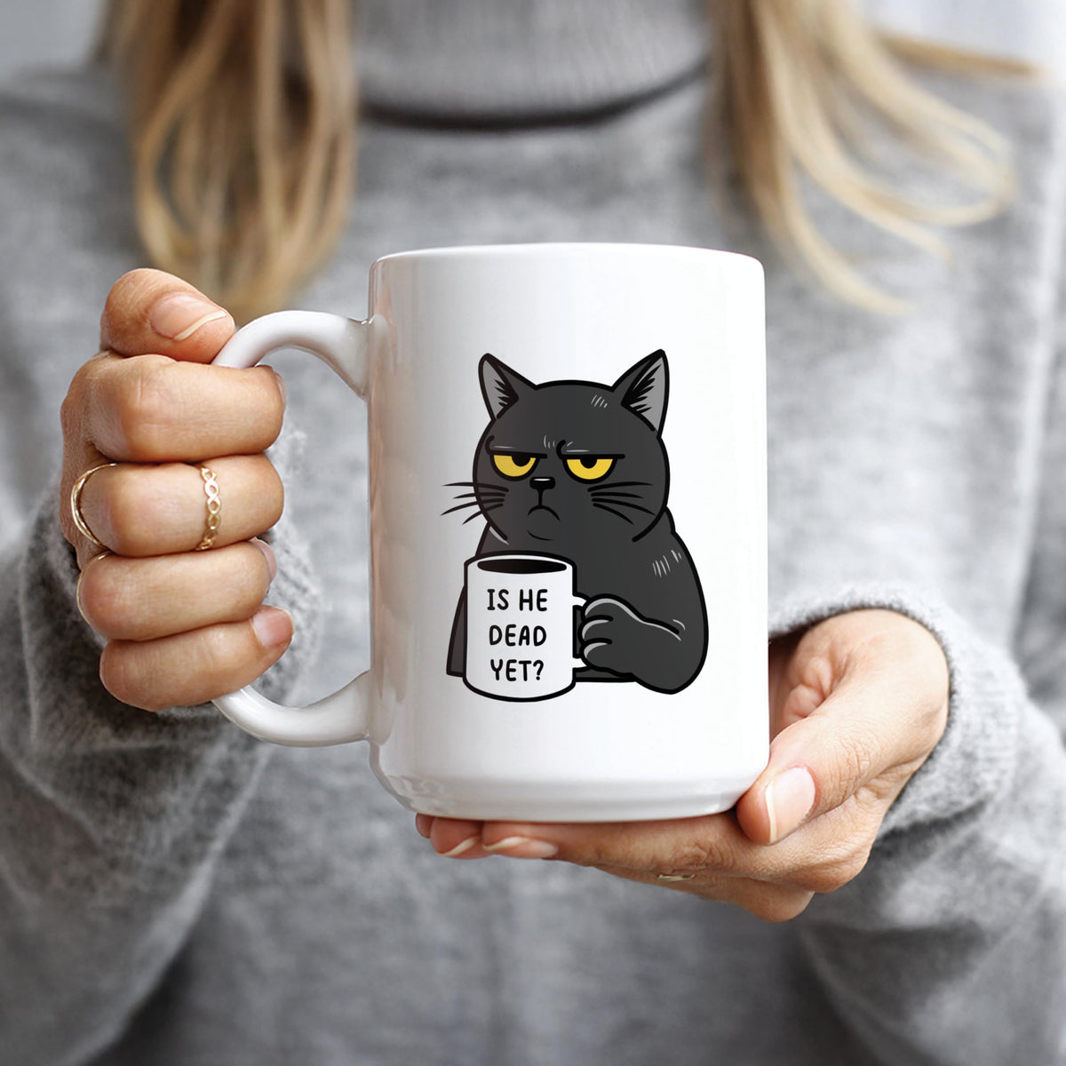 Hogg Is He Dead Yet mug, held by handle for a comfortable morning ritual.