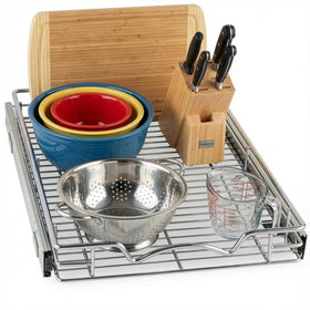 HOLDN’ STORAGE pull-out drawer open showing easy access to spices and cookware.