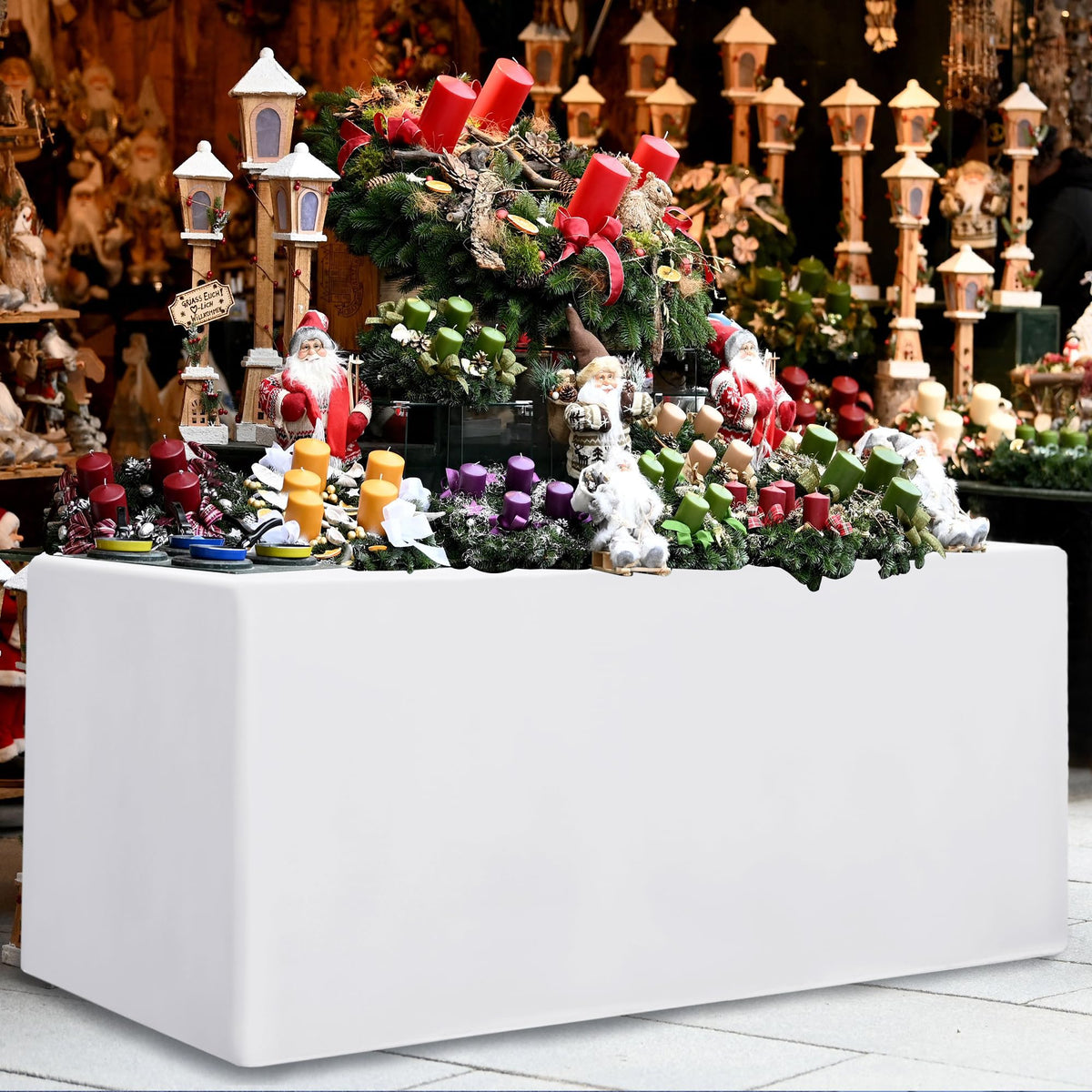 HolidayIdeas tablecloth conceals legs and cords on a 48x24 table for a neat presentation.