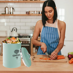Holismo countertop compost bin in use with scraps for convenient indoor composting