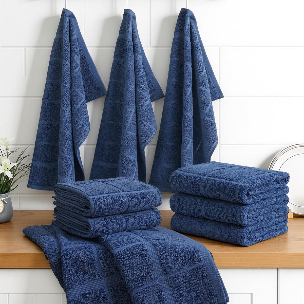Elegant navy Homaxy towel set displayed on a kitchen counter.