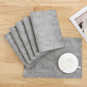 Homaxy light-grey faux-leather placemats enhance table aesthetics and durability.