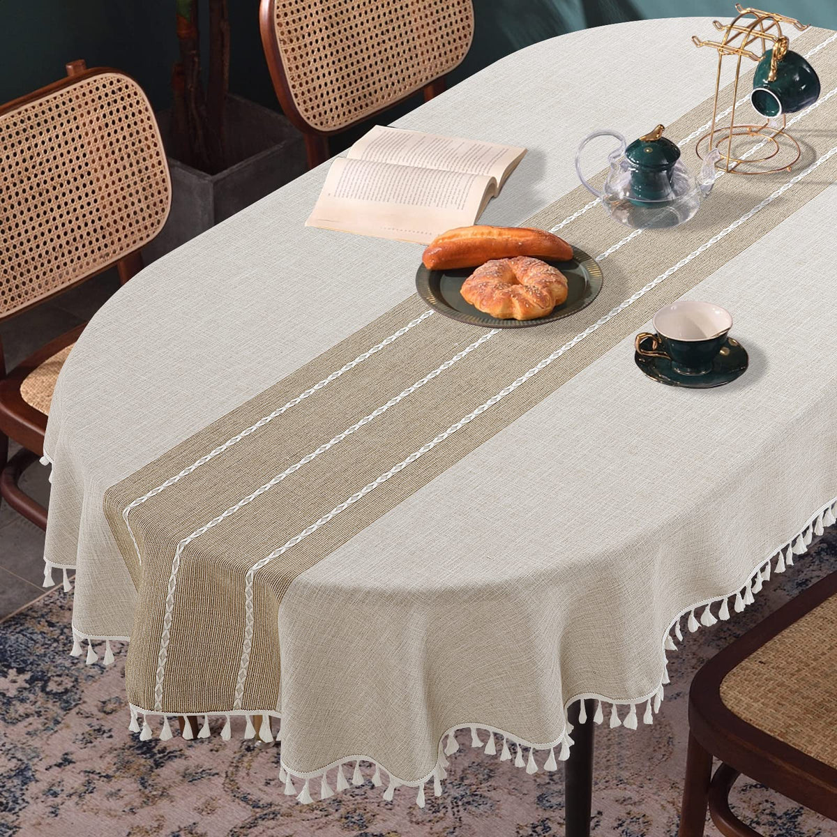 HOMBYS oval tablecloth with tassels adds elegant embroidery to the dining table.