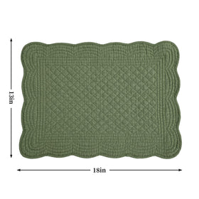 Close-up of emerald green quilting on HOMBYS placemats showing stitching detail.