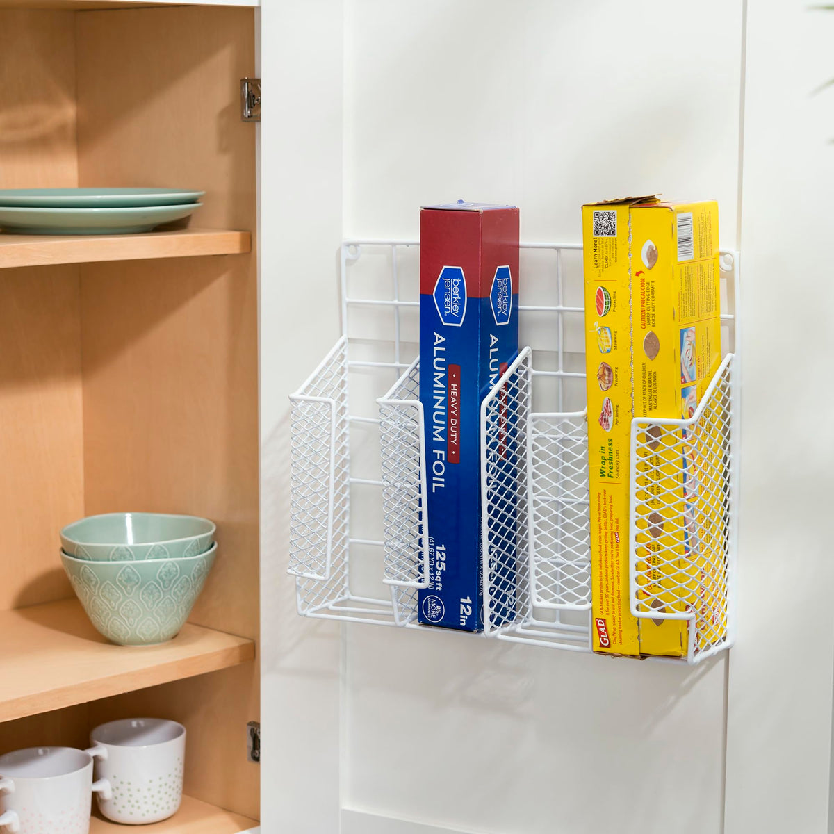 Home Basics wall or cabinet door mount saves counter space.
