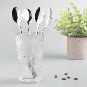 homEdge coffee spoon resting in a mug for easy stirring.