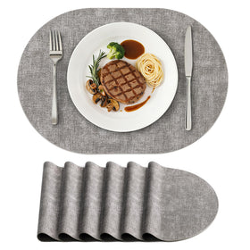 Homing oval placemats set shows heat resistance and table protection.