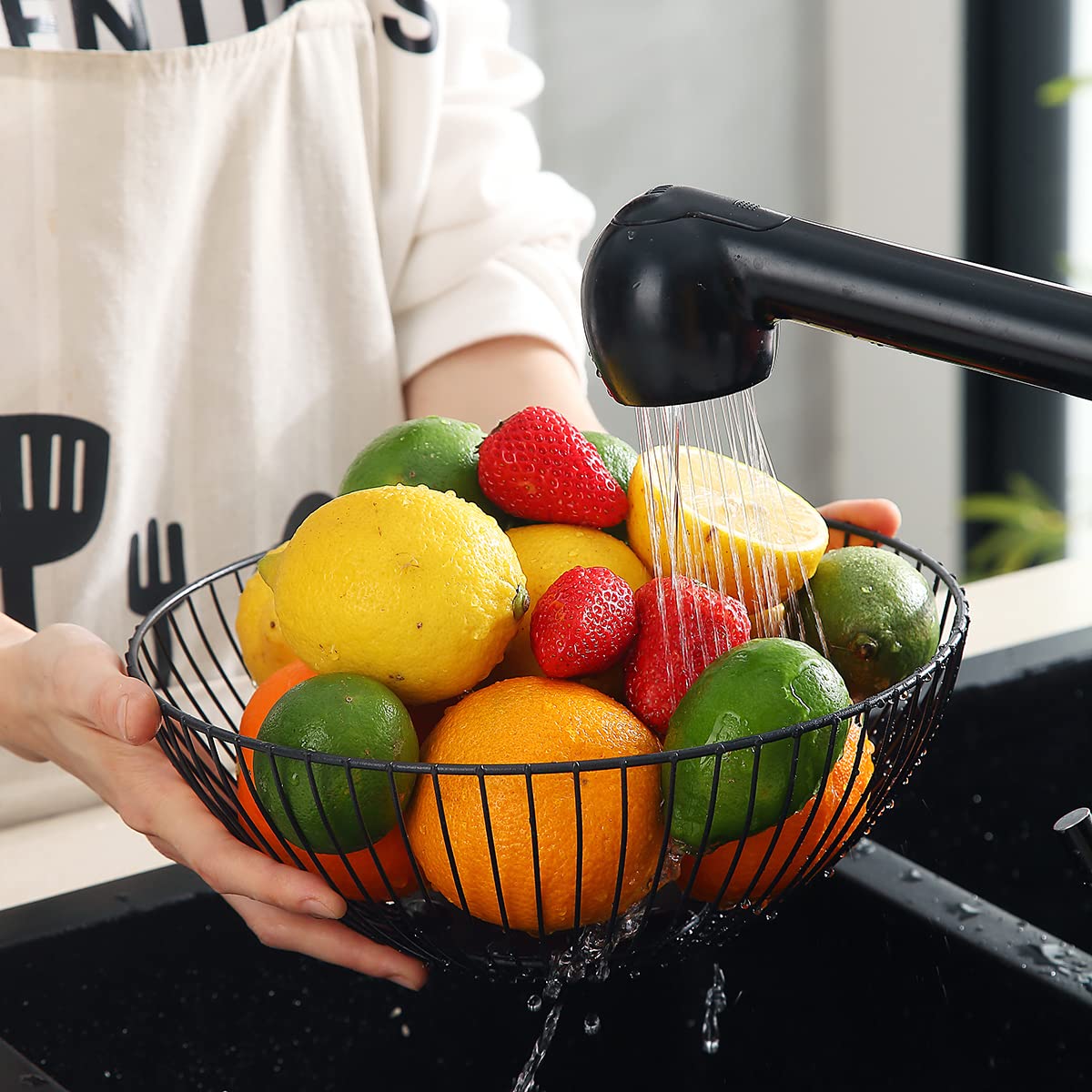 HOMQUEN black metal basket styled with fruits and bread