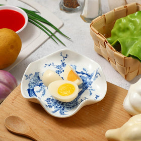 Honeydak blue and white spoon rest styled with desserts and small snacks