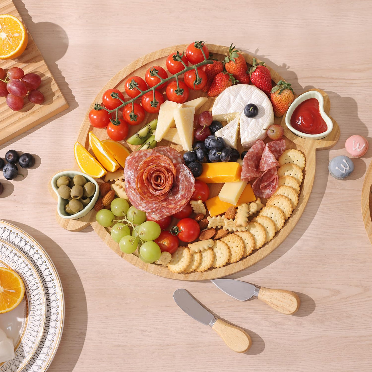 Hongsane board with two ceramic bowls enhances dipping sauces and olives presentation.