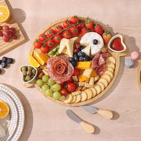 Hongsane board with two ceramic bowls enhances dipping sauces and olives presentation.