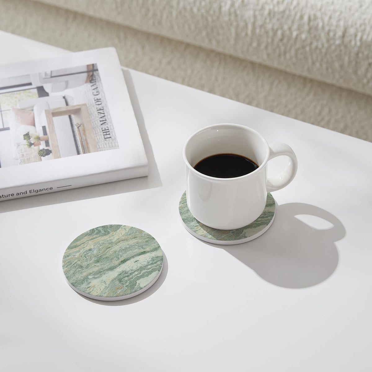 Hoomey absorbent ceramic coaster quickly wicks moisture from drinks.