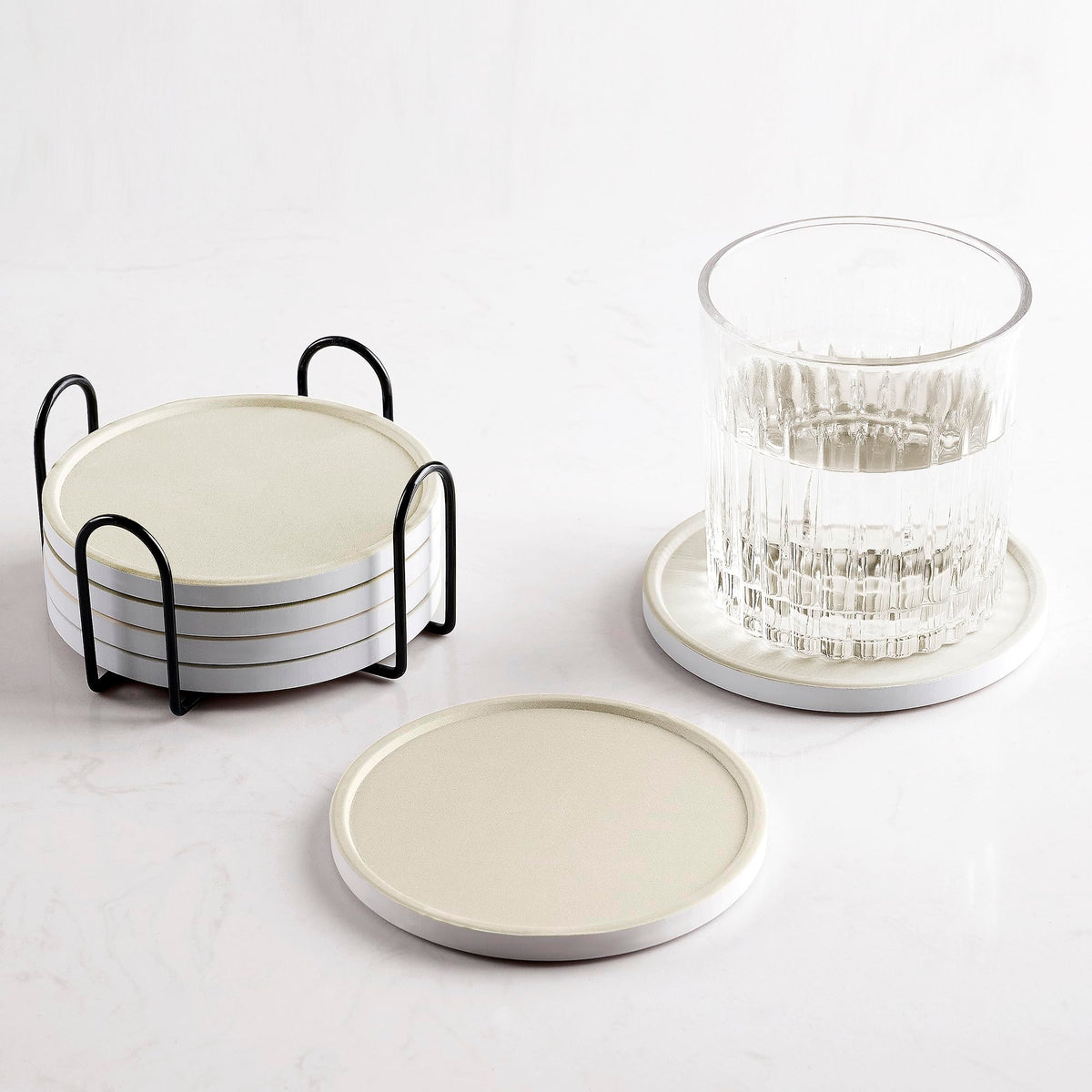 Hoomey beige ceramic coasters with holder for neat storage and surface protection.