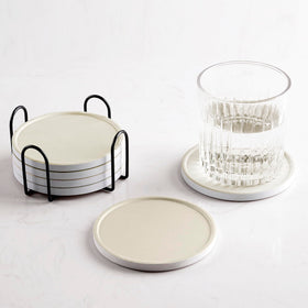 Hoomey beige ceramic coasters with holder for neat storage and surface protection.