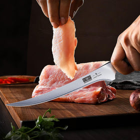 Slim blade of HOSHANHO fillet knife slicing fish with precision.