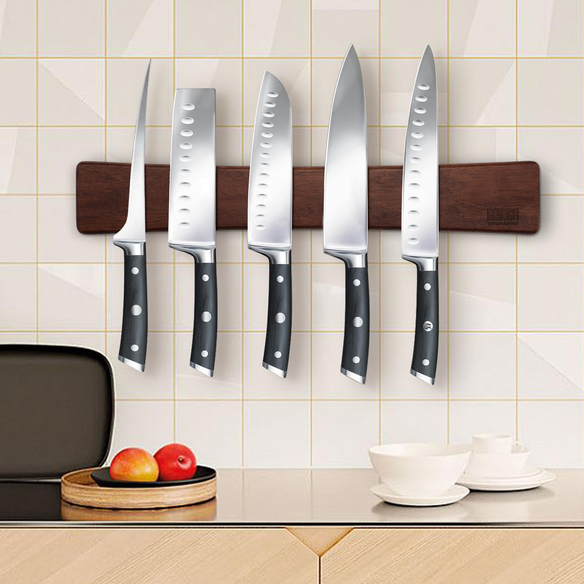 HOSHANHO multipurpose magnetic rack holds knives, scissors, and utensils.