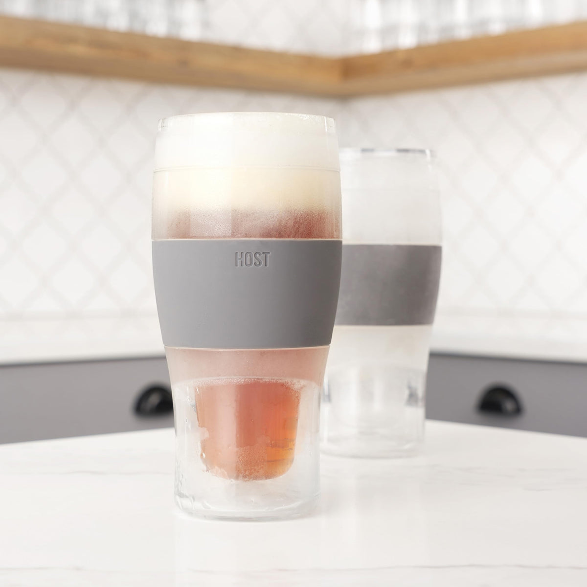 Host Freeze gray double-wall pint shown as modern barware.