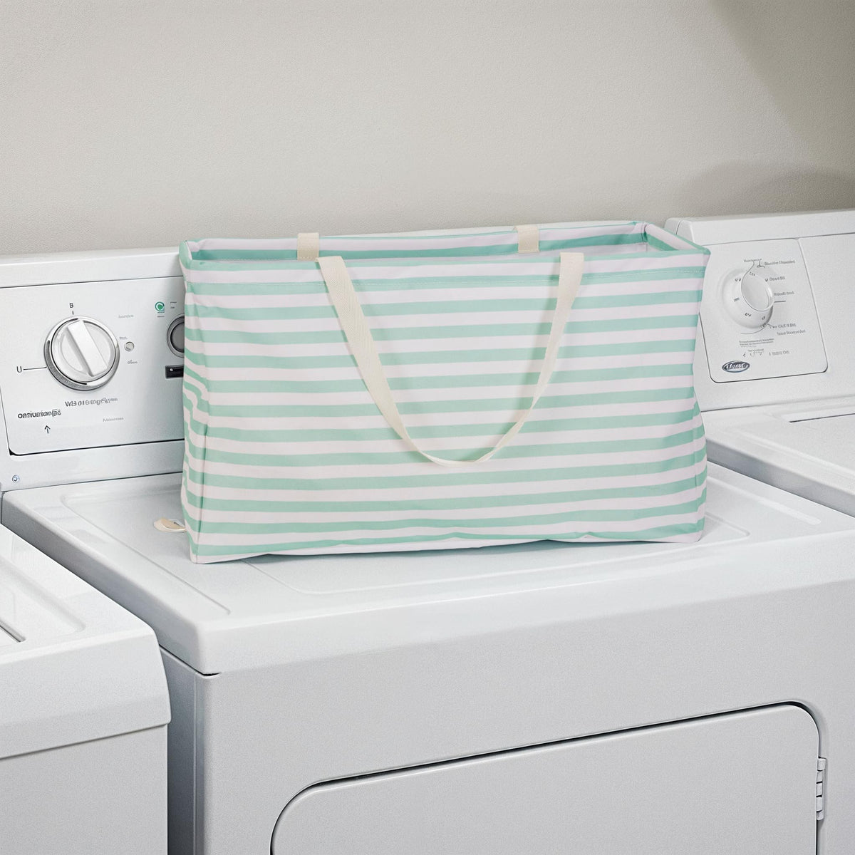 Household Essentials Teal Striped Krush tote in linen closet for towels and blankets.