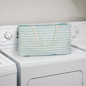 Household Essentials Teal Striped Krush tote in linen closet for towels and blankets.