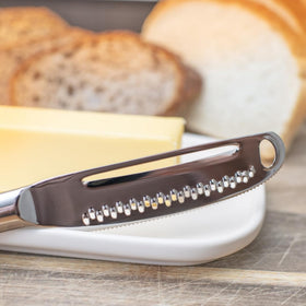 Houseify READY BUTTER PRO knife showing serrated edge for slicing cheeses and preserves.
