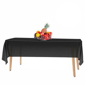 HSGUS kitchen dining table covered with 54x108 black disposable tablecloths.
