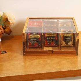 HTB acacia wood tea storage box on a counter enhances your tea setup.