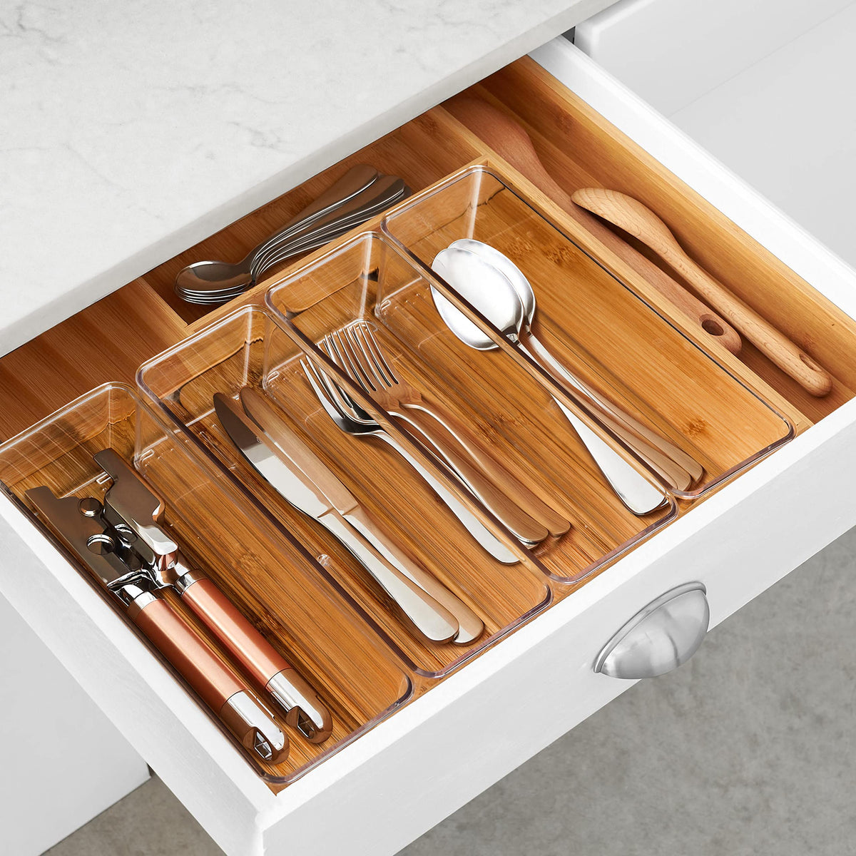 See-through plastic storage bin shown inside a drawer for easy access