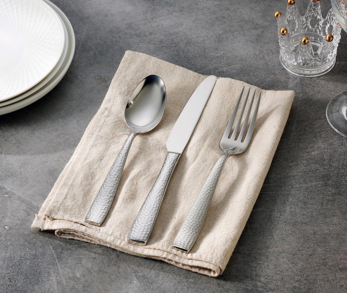 Hudson Essentials hammered flatware close-up; mirror finish showcases craftsmanship.