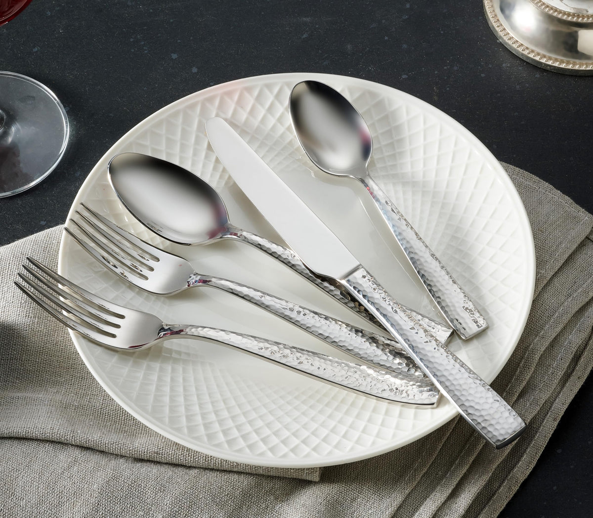 Hudson Essentials hammered flatware ergonomic hold; comfortable to use.