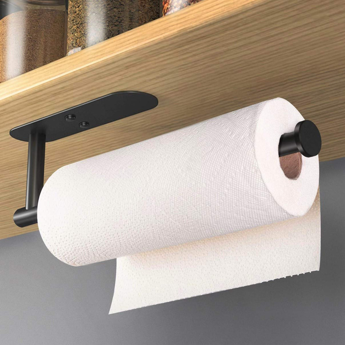 HUFEEOH under-cabinet paper towel holder mounted with adhesive for easy kitchen setup.