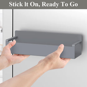 HuggieGems four-pack dark gray magnetic holders mounted on fridge for quick reach
