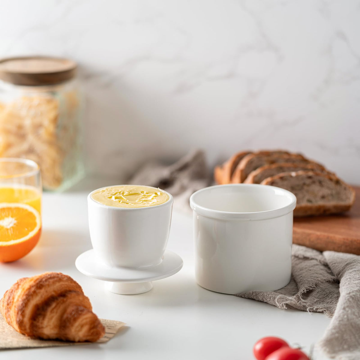 Husfunov butter crock lid shown with butter for airtight storage