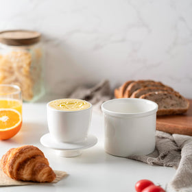Husfunov butter crock lid shown with butter for airtight storage