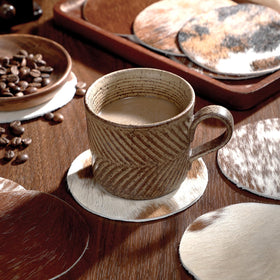 Hushee cowhide coaster with unique pattern, ideal for stylish gifting.