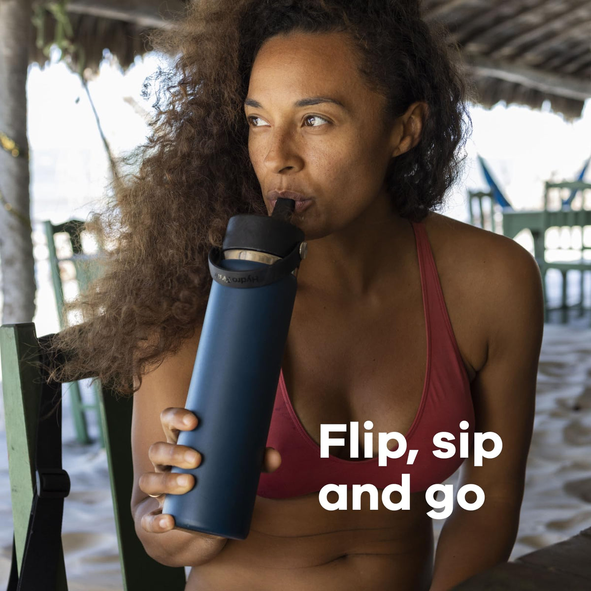 Hands holding the bottle highlights the sturdy, comfortable handle.
