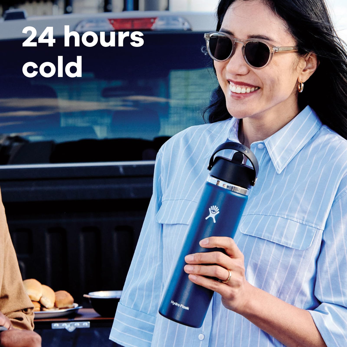 Hydro Flask Ivory bottle fits securely in a cupholder during travel.