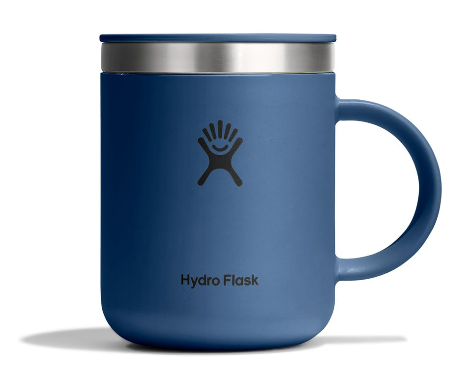 Hydro Flask Coffee Mug Harbor Blue 12oz on desk keeps drinks hot for hours.