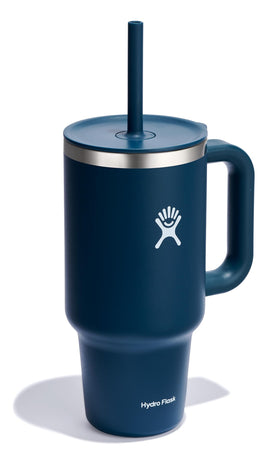 Hydro Flask indigo tumbler close-up shows ergonomic handle for easy grip.