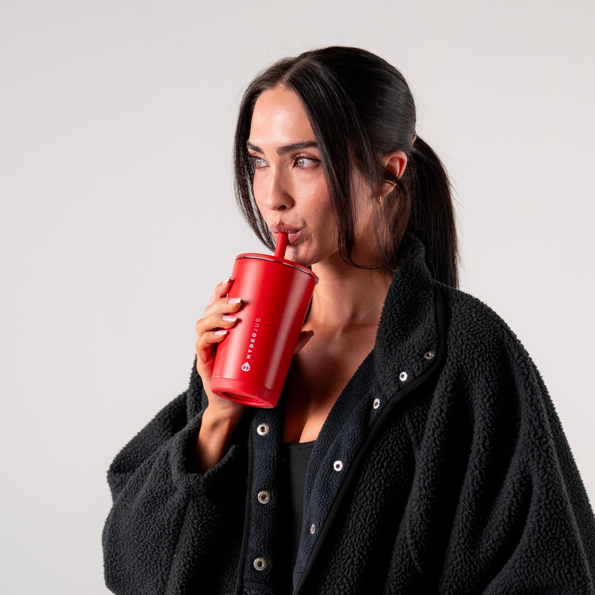 Alumni Red HydroJug tumbler, a stylish everyday companion for work and travel.