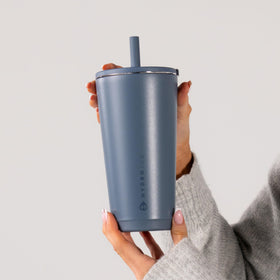 HydroJug's slim base fits most cup holders for travel stability.