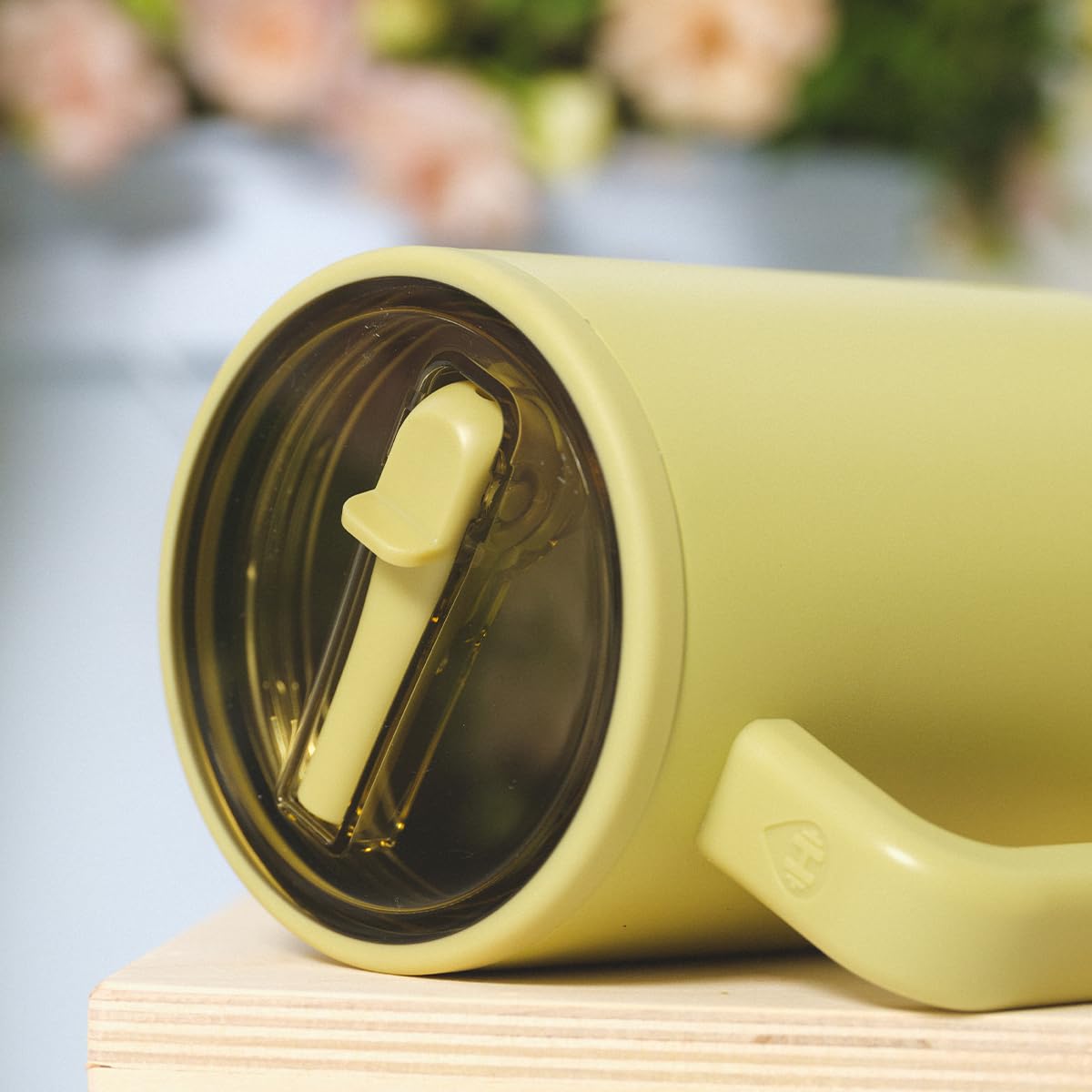 HydroJug Traveler in cupholder demonstrating compatibility for travel days.