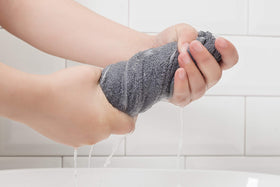 HYER KITCHEN plush microfiber towel demonstrating absorbent performance