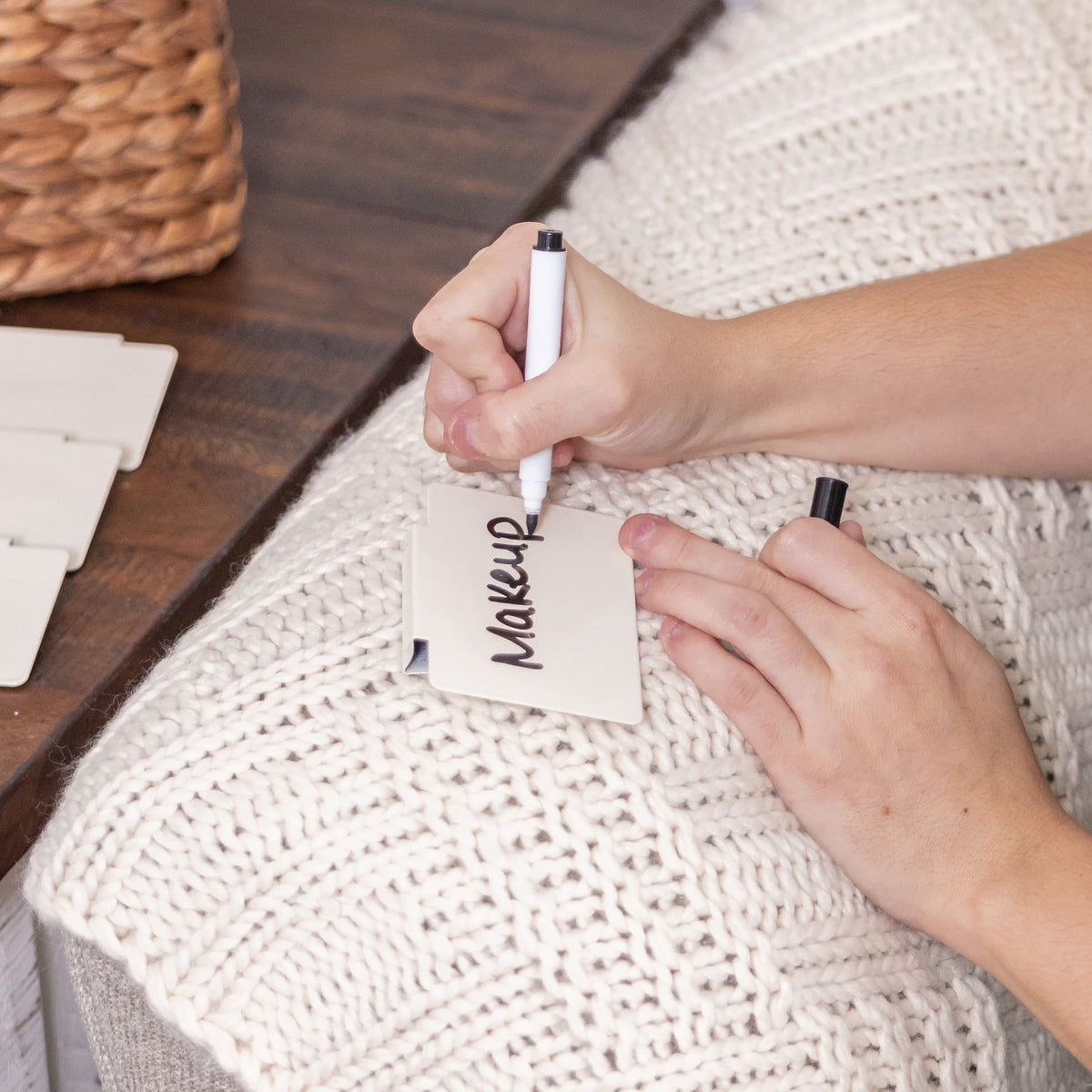 Labels shown on wood and wicker baskets for warm organization