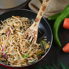 HYGNN utensils in use during family serving, illustrating versatile kitchen performance.